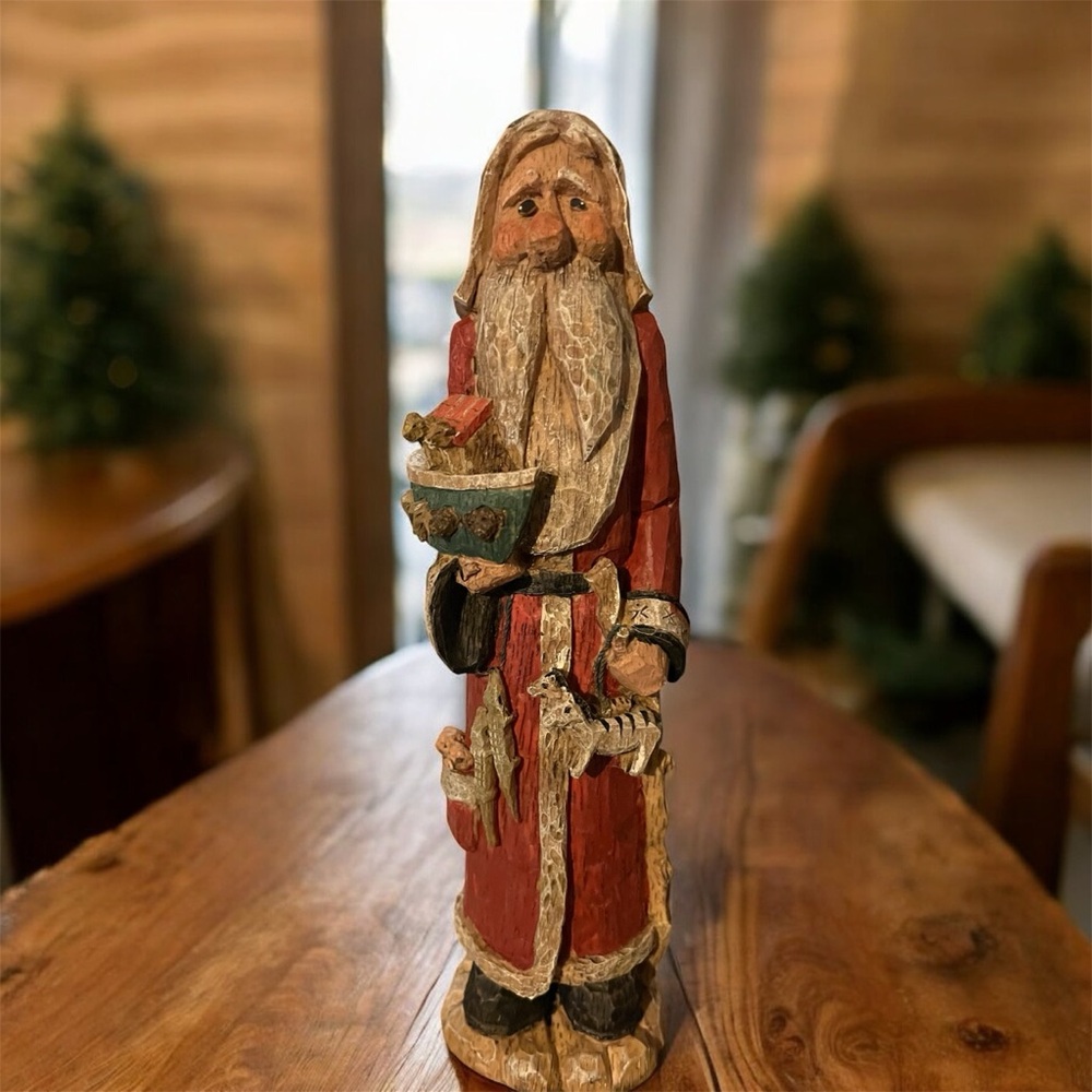 Vintage rustic Santa Claus figurine holding animals and small ark